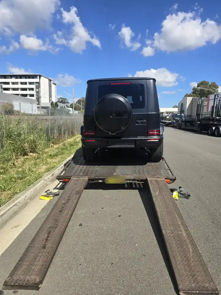 Mercedes G-Class driven onto a car trailer for collection
